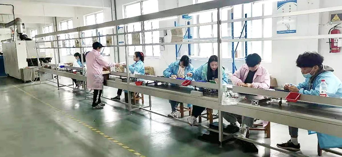 Operators working along a final assembly line